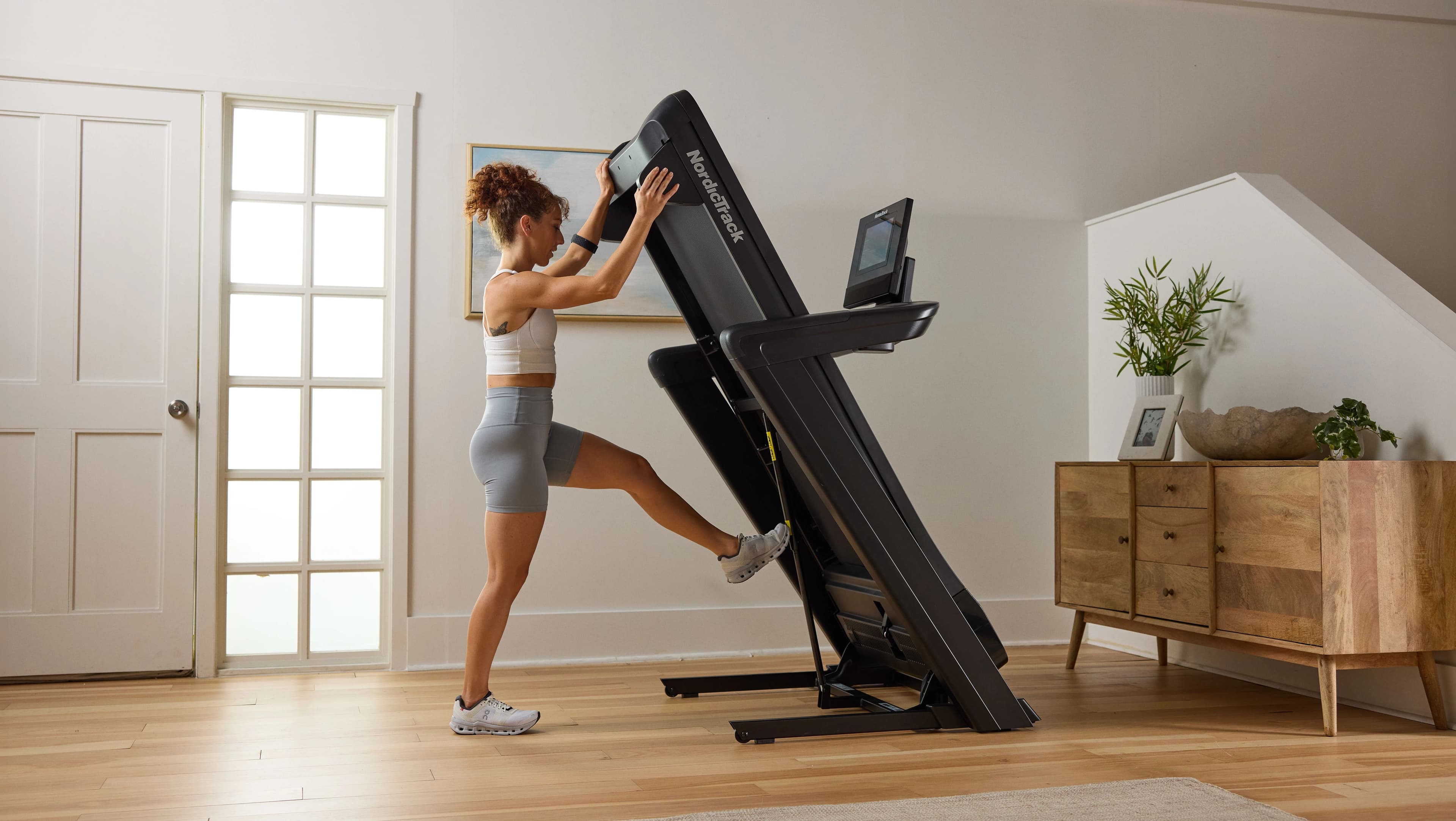 Best NordicTrack treadmill for apartments with compact foldable design and immersive iFIT display
