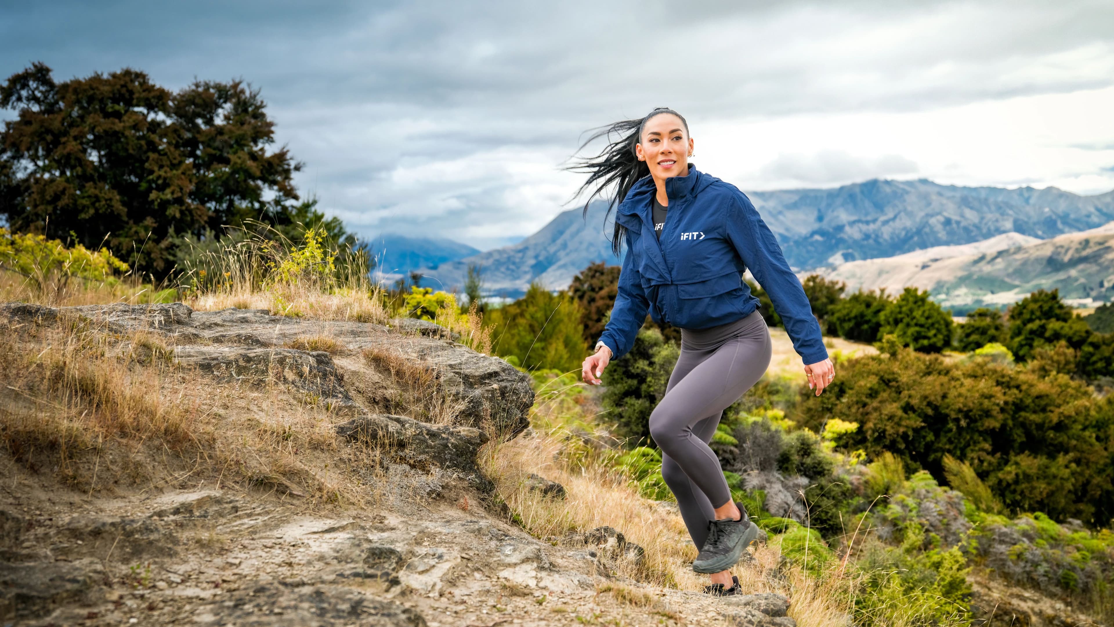 See terrain-driven training in action as iFIT trainer Hannah Eden leads a New Zealand hiking workout built for real incline and uneven terrain.