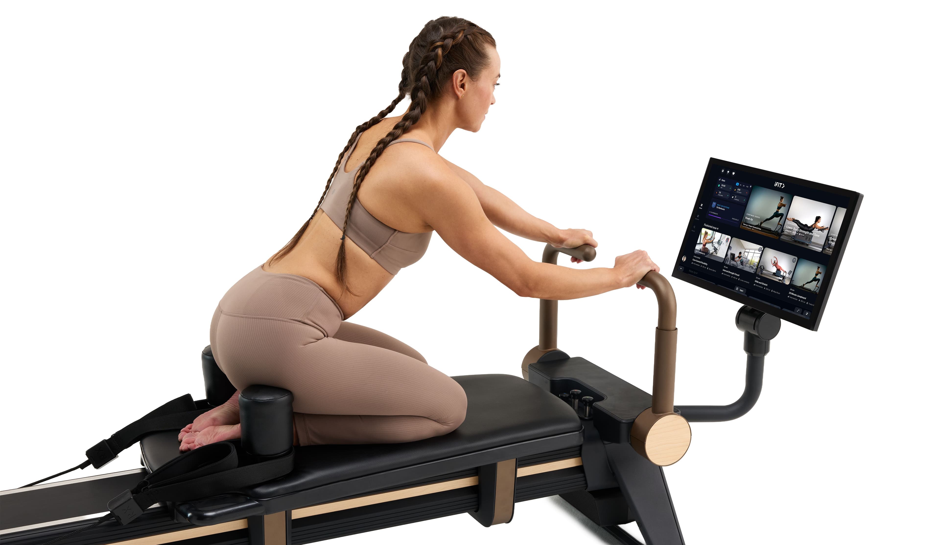 NordicTrack Pilates reformer with integrated iFIT touchscreen showing on-demand class library, demonstrating connected reformer training at home. No subscription required to use the machine.